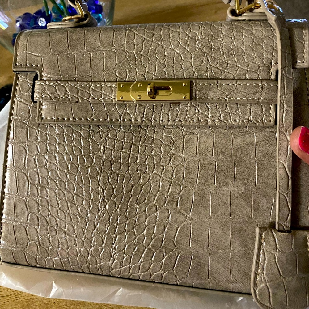 Leather tan khaki satchel new with handle straps, feet, and inside storage
